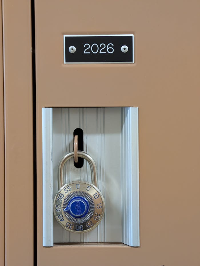 Locker number 2026 secured with a blue combination padlock, emphasizing safety.